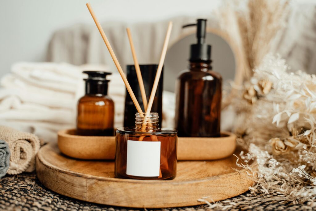 A soothing aromatherapy arrangement with amber bottles and dried flowers, perfect for a calming atmosphere.